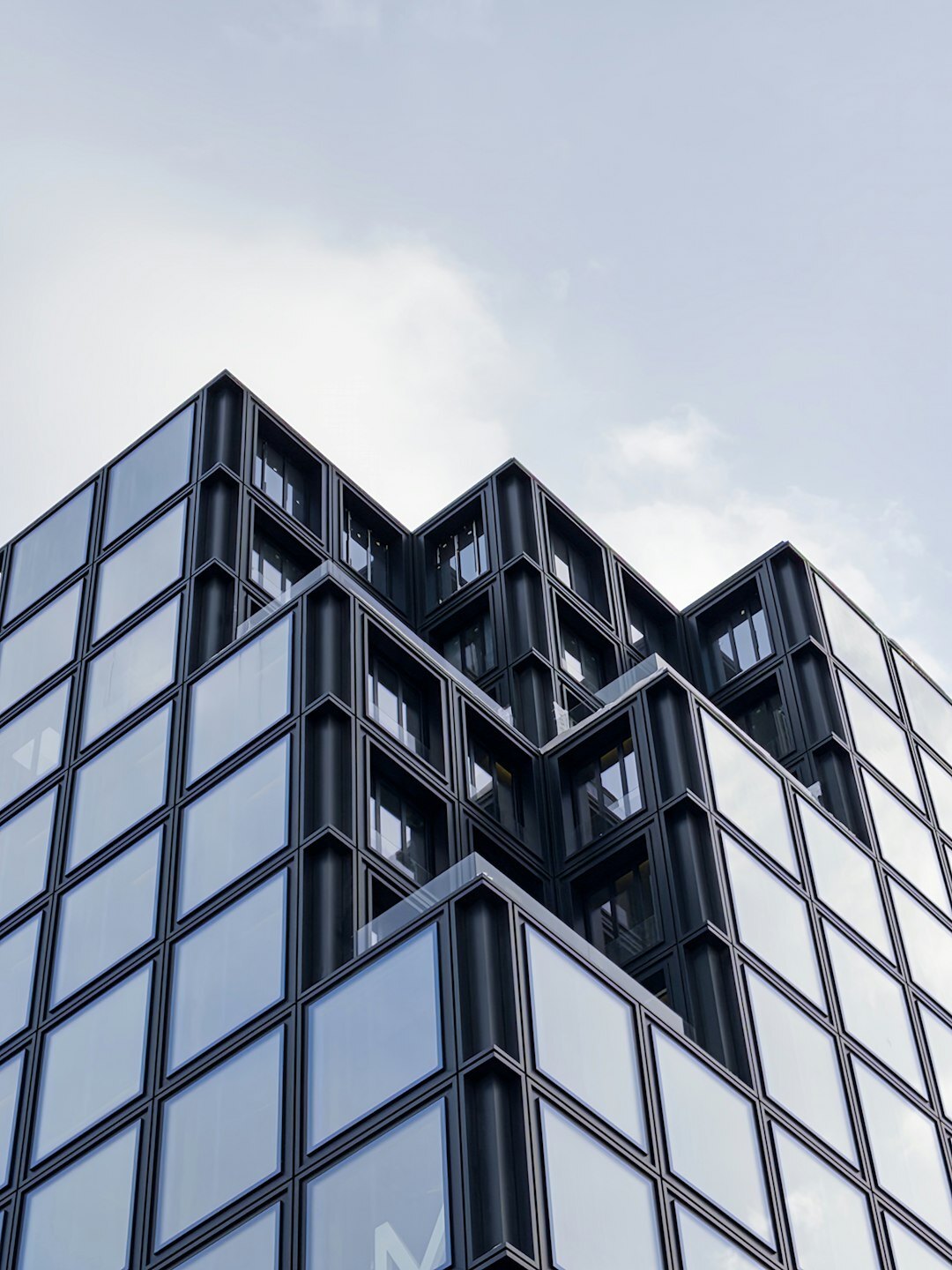 Modern media company office building exterior with glass facade