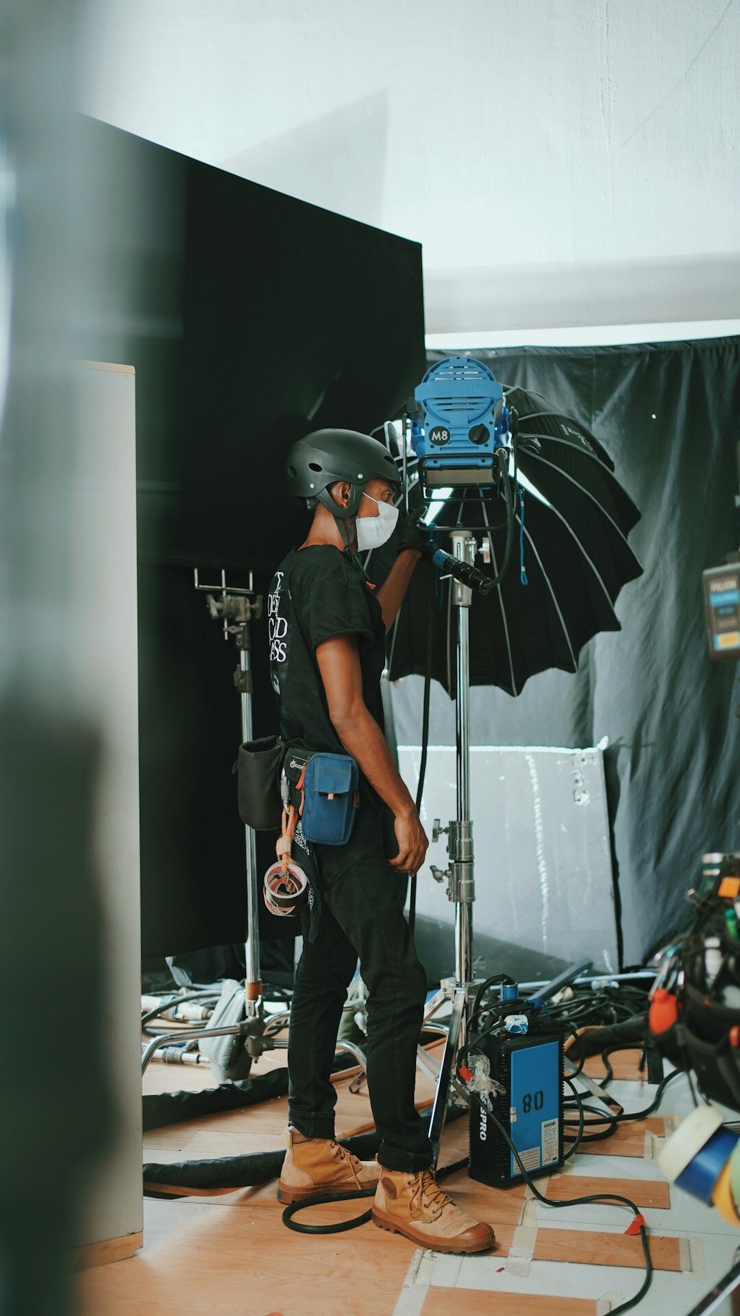Camera operator filming inside a television studio